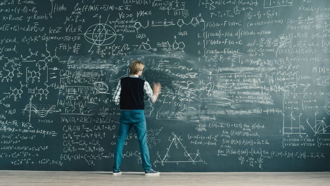 Man presenting ideas on a whiteboard to colleagues